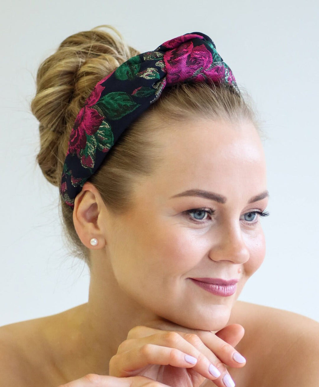 3. Women's Knot Headband Flora by Eva Oherjus in floral pattern, worn by model with elegant updo hairstyle