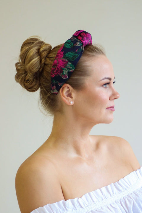 1. Women's Knot Headband Flora by Eva Oherjus in vibrant floral motif, worn by model with updo hairstyle