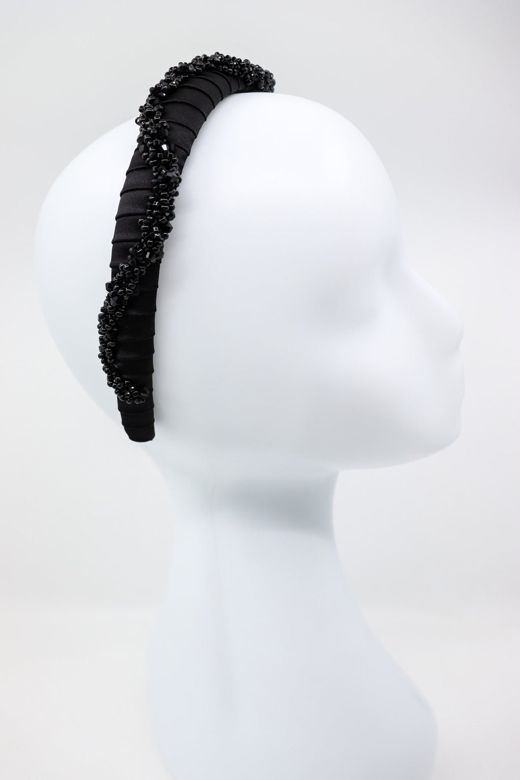 5. Profile view of Eva Oherjus Beaded Thin Mulberry Silk Headband Hestia on mannequin