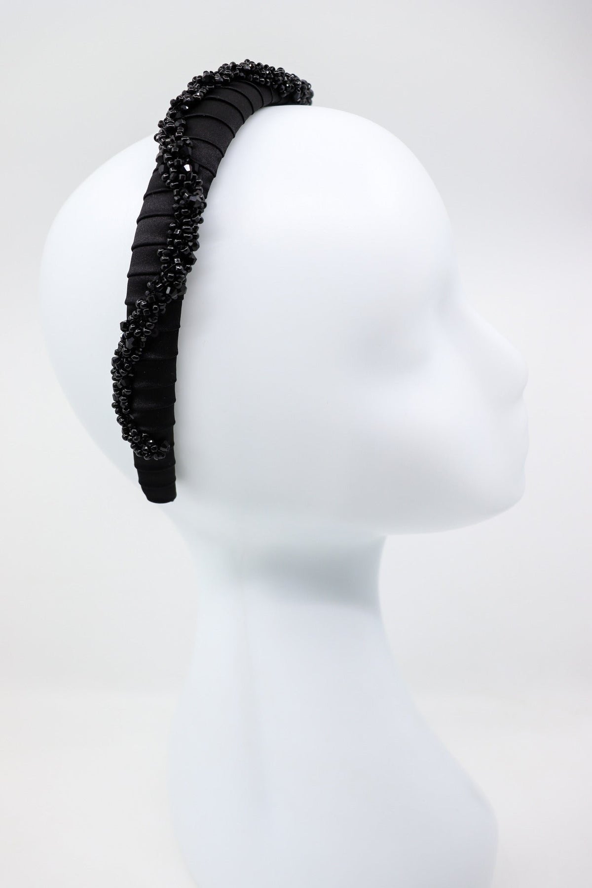 5. Profile view of Eva Oherjus Beaded Thin Mulberry Silk Headband Hestia on mannequin