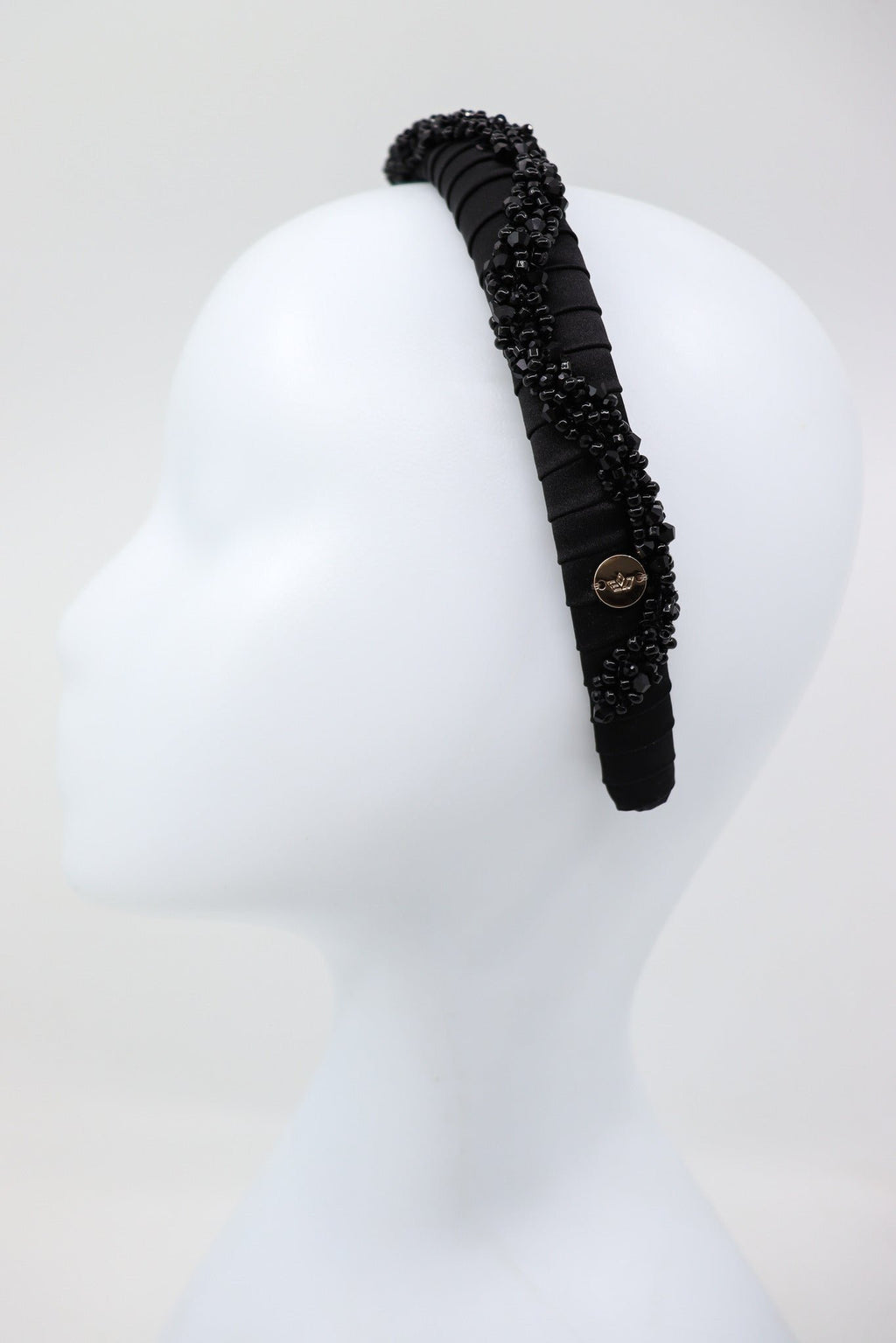 4. Side view of Eva Oherjus Beaded Thin Mulberry Silk Headband Hestia on mannequin head