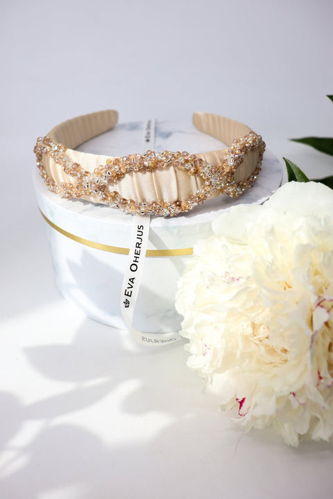 1. Eva Oherjus Mulberry Silk Headband Ada with Swarovski crystals, displayed on luxury hat box with flowers