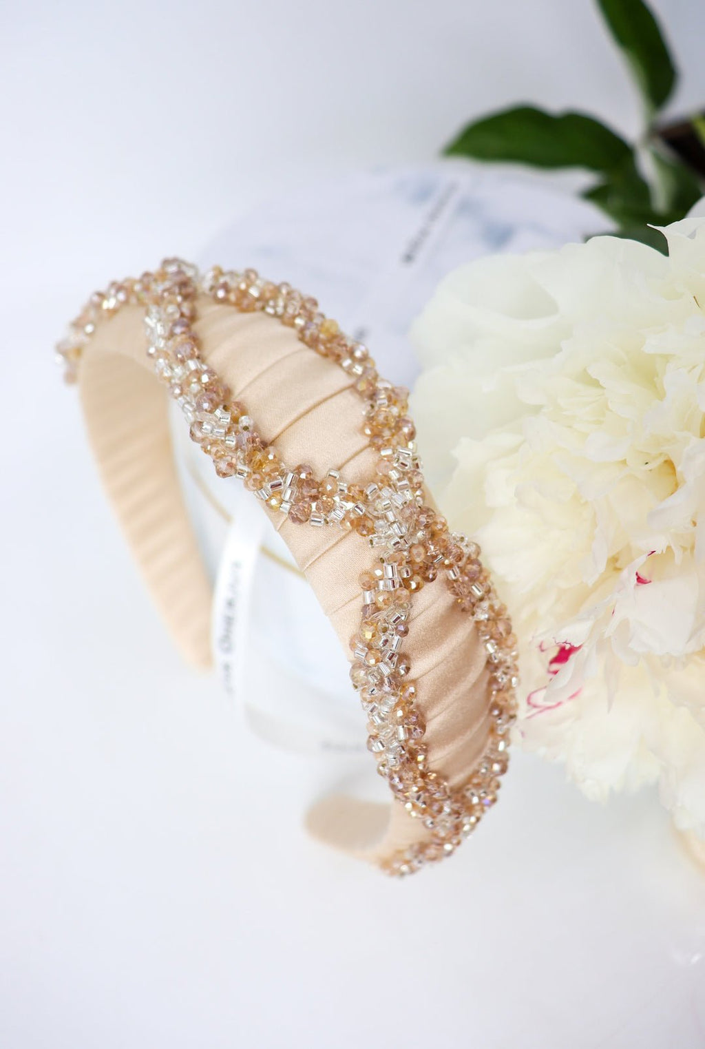 4. Close-up of Eva Oherjus Mulberry Silk Headband Ada Thin, showing intricate Swarovski crystal beading and silk texture