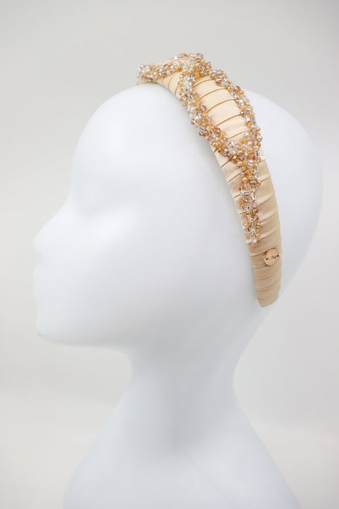 3. Side view of Eva Oherjus Mulberry Silk Headband Ada on mannequin, showcasing hand-beaded embellishments