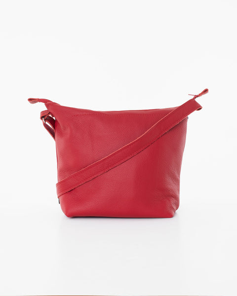 2. Back view of Trendbag Suvi XS red shoulder bag highlighting versatile strap design, studio shot