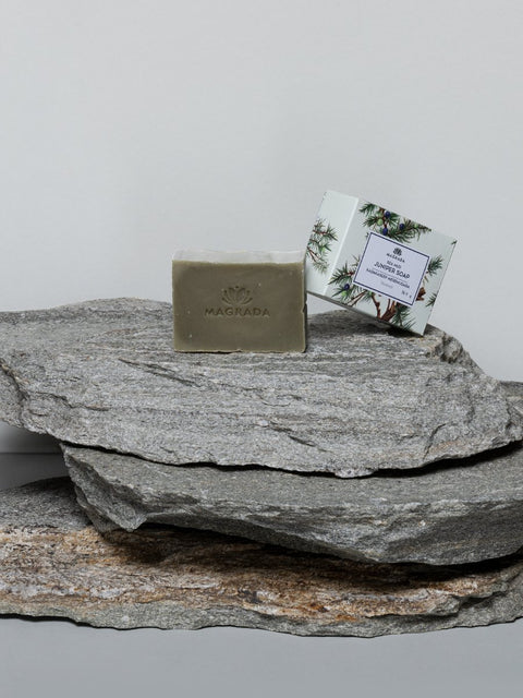 1. Magrada Organic Cosmetics Juniper and Sea Mud Soap displayed on natural stone, highlighting packaging and soap bar