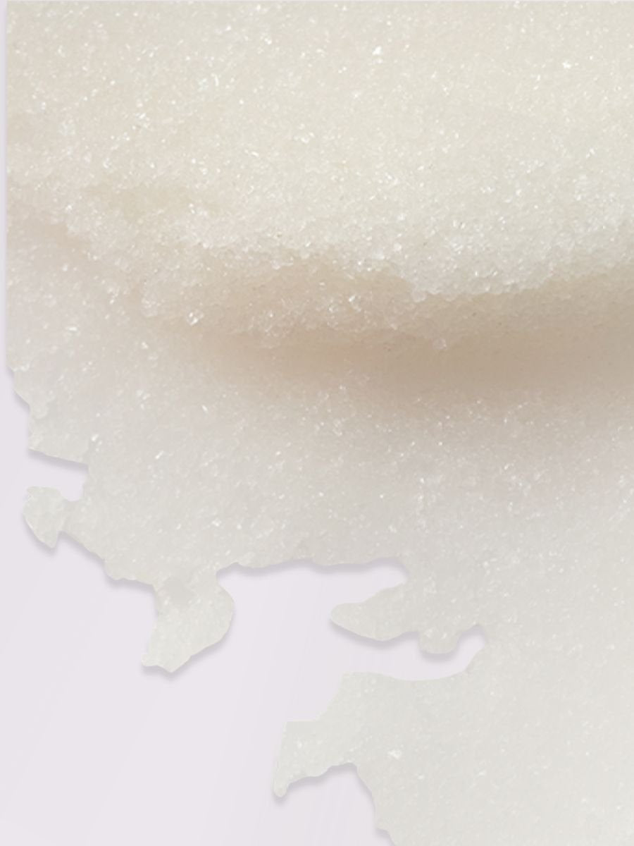 3. Close-up texture of Magrada Organic Cosmetics Peony Body Scrub showing mineral-rich sea salt granules