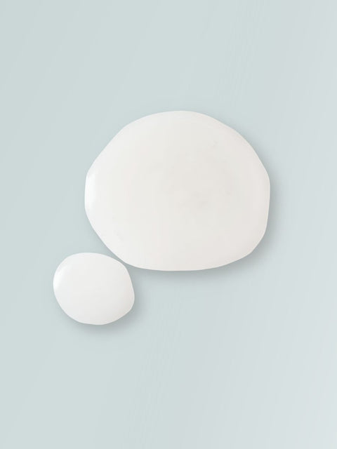 3. Magrada Organic Cosmetics Firming Algae Body Serum and Body Cream set on sand, emphasizing product line