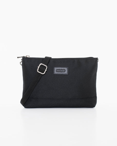 1. Nabo L2480 black shoulder bag in studio setting, showing front view with adjustable strap and brand logo