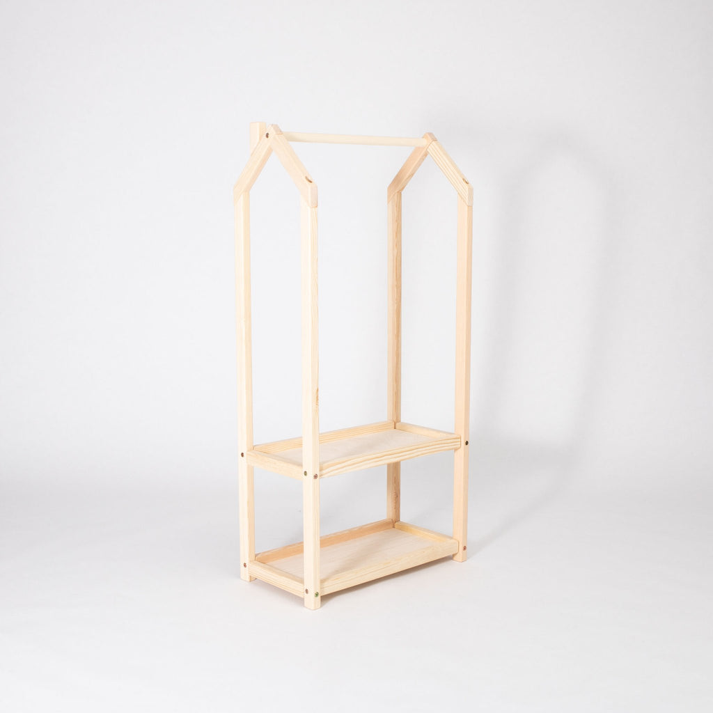 2. Natural wood house-shaped clothing rack with two shelves on a white background