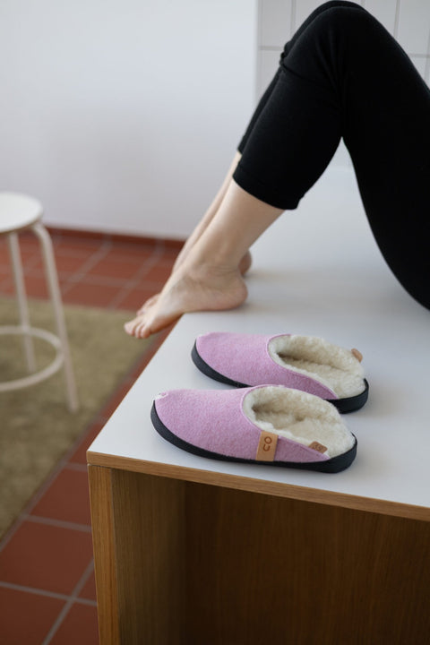 1. Women's TOKU Brussels light pink lambswool slippers by Omaking, shown in lifestyle setting