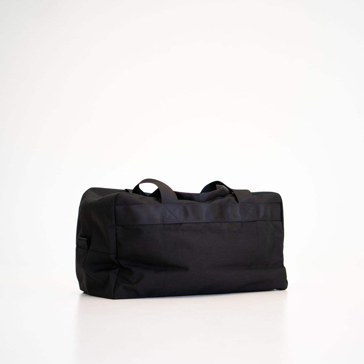 3. Side view of Galvi-Linda Travel Bag 008 in black, showing sturdy handles and sleek design