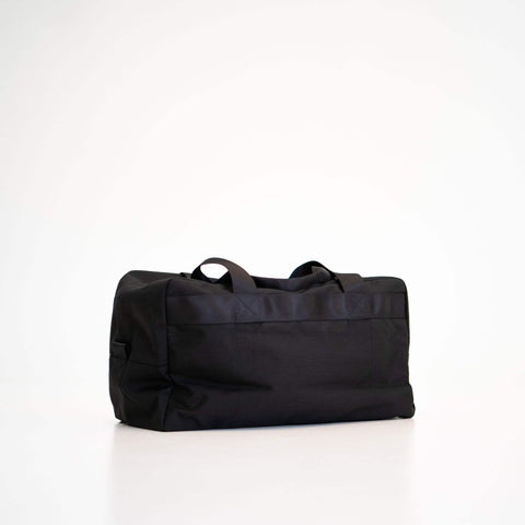3. Side view of Galvi-Linda Travel Bag 008 in black, showing sturdy handles and sleek design