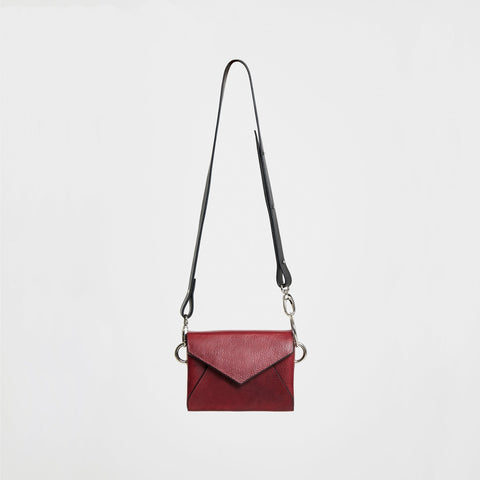 4. Studio shot of Daz Studio burgundy leather envelope bag with adjustable strap, shown from front