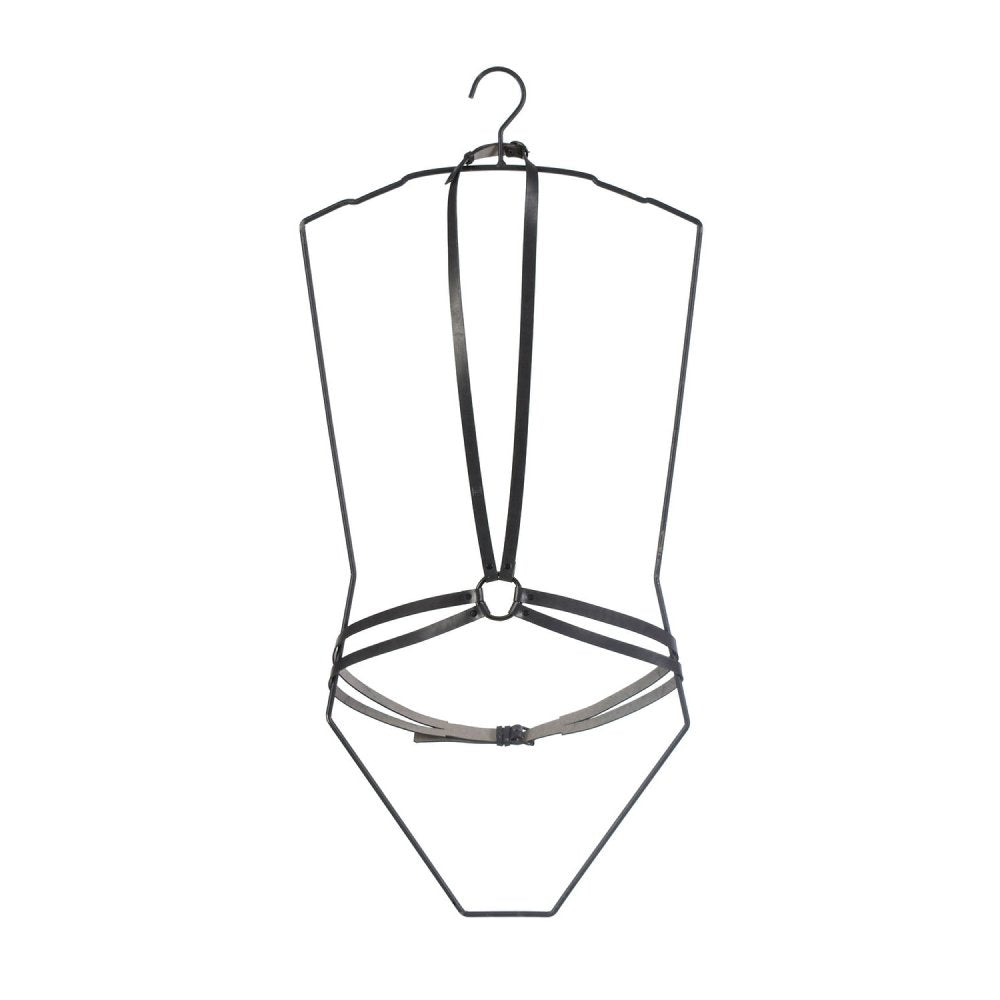 7. Studio shot of black leather body harness by RR on a hanger, highlighting design and structure