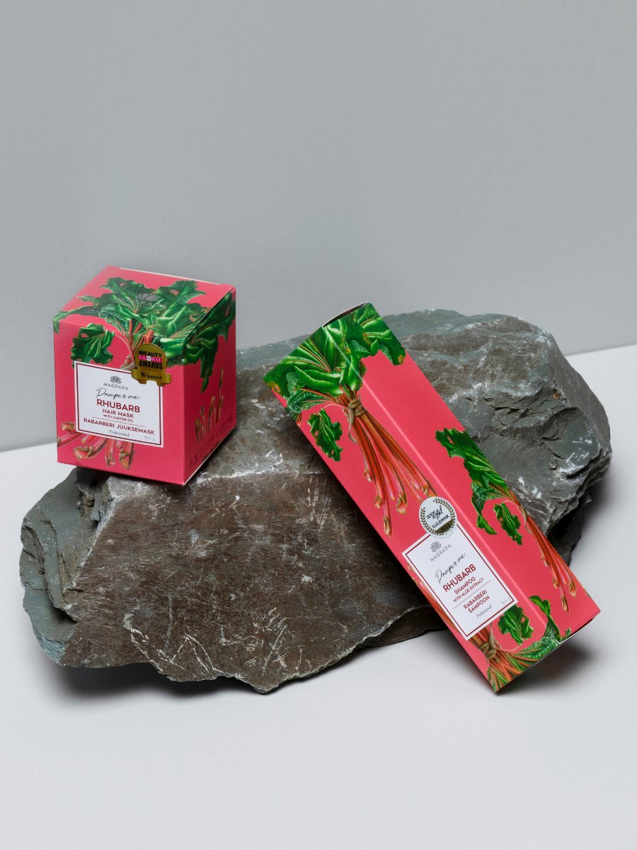 3. Magrada Organic Cosmetics Rhubarb Shampoo packaging with aloe extract, displayed on a rock