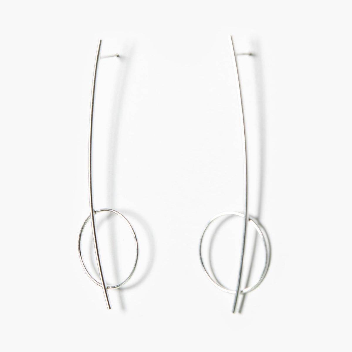 2. Studio image of Maarja Palu HARMONY silver earrings with sleek rods and delicate circles