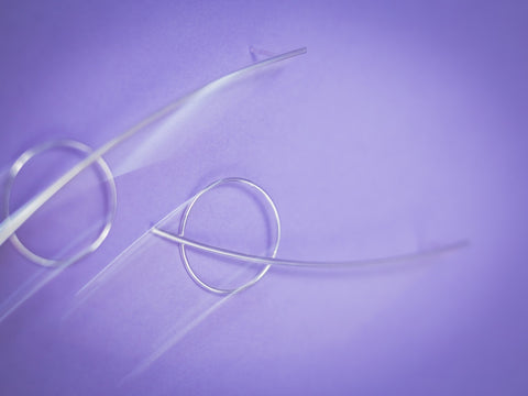 3. Close-up of Maarja Palu HARMONY silver earrings on purple background, highlighting modern minimalist design