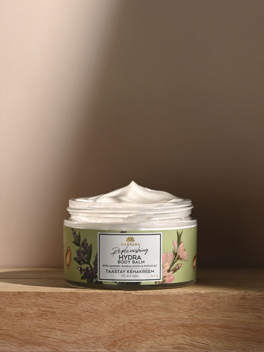 5. Open jar of Magrada X Lauren Replenishing Body Balm showing creamy texture in studio