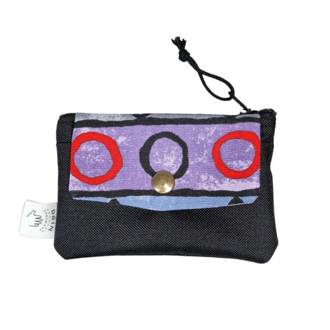 1. Drinbags ZIG ZAG wallet in vibrant reused fabric with purple and red design, featuring a secure metal press button and zipper closure, shown in studio