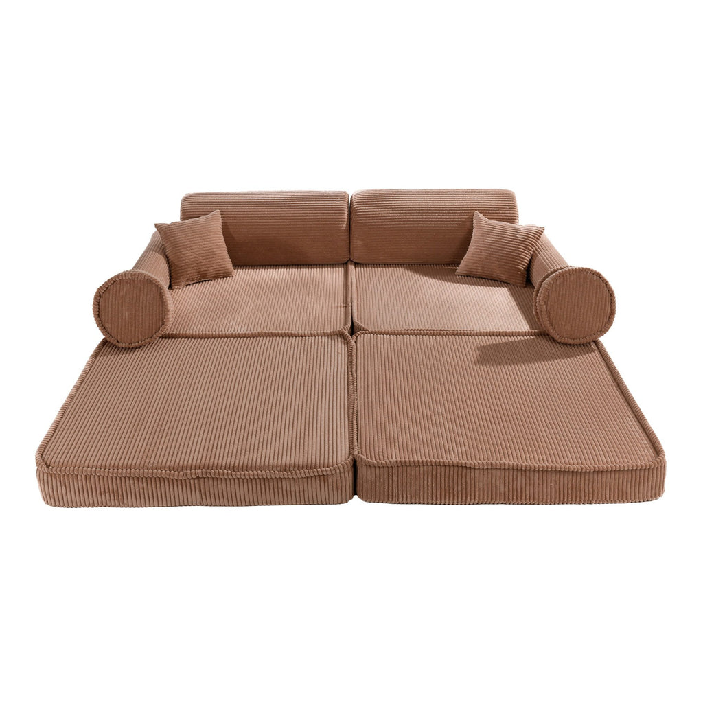 1. Large modular children's sofa in powder pink corduroy with multiple cushions, shown in a flat configuration