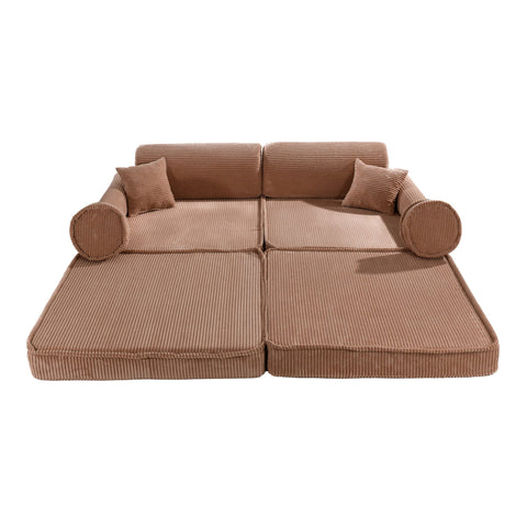 1. Large modular children's sofa in powder pink corduroy with multiple cushions, shown in a flat configuration