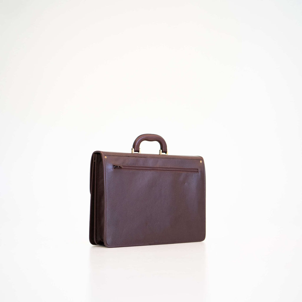 3. Side view of Papillon Leather Briefcase No. 99 in dark brown, highlighting sleek design and back pocket