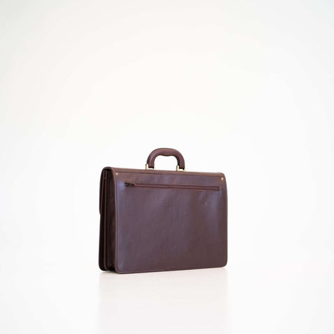 3. Side view of Papillon Leather Briefcase No. 99 in dark brown, highlighting sleek design and back pocket