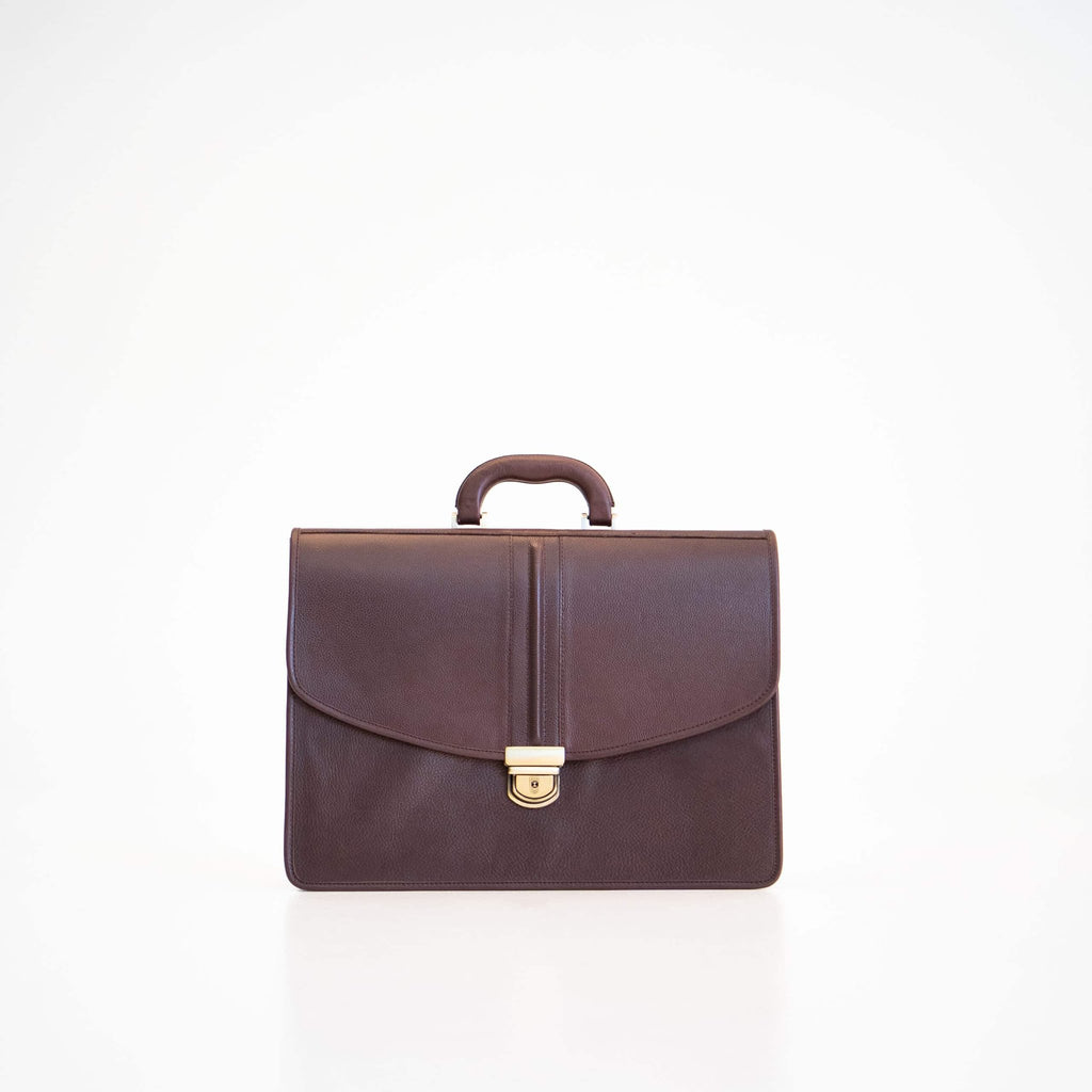 4. Front view of Papillon Leather Briefcase No. 99 in dark brown, showing gold clasp and handle