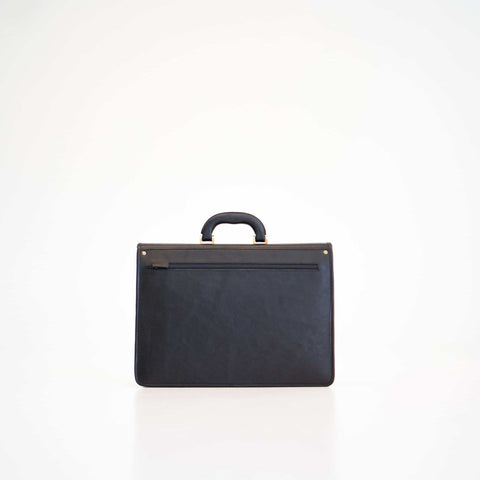 4. Studio shot of Papillon Leather Briefcase No. 99 in black, showing back view with handle