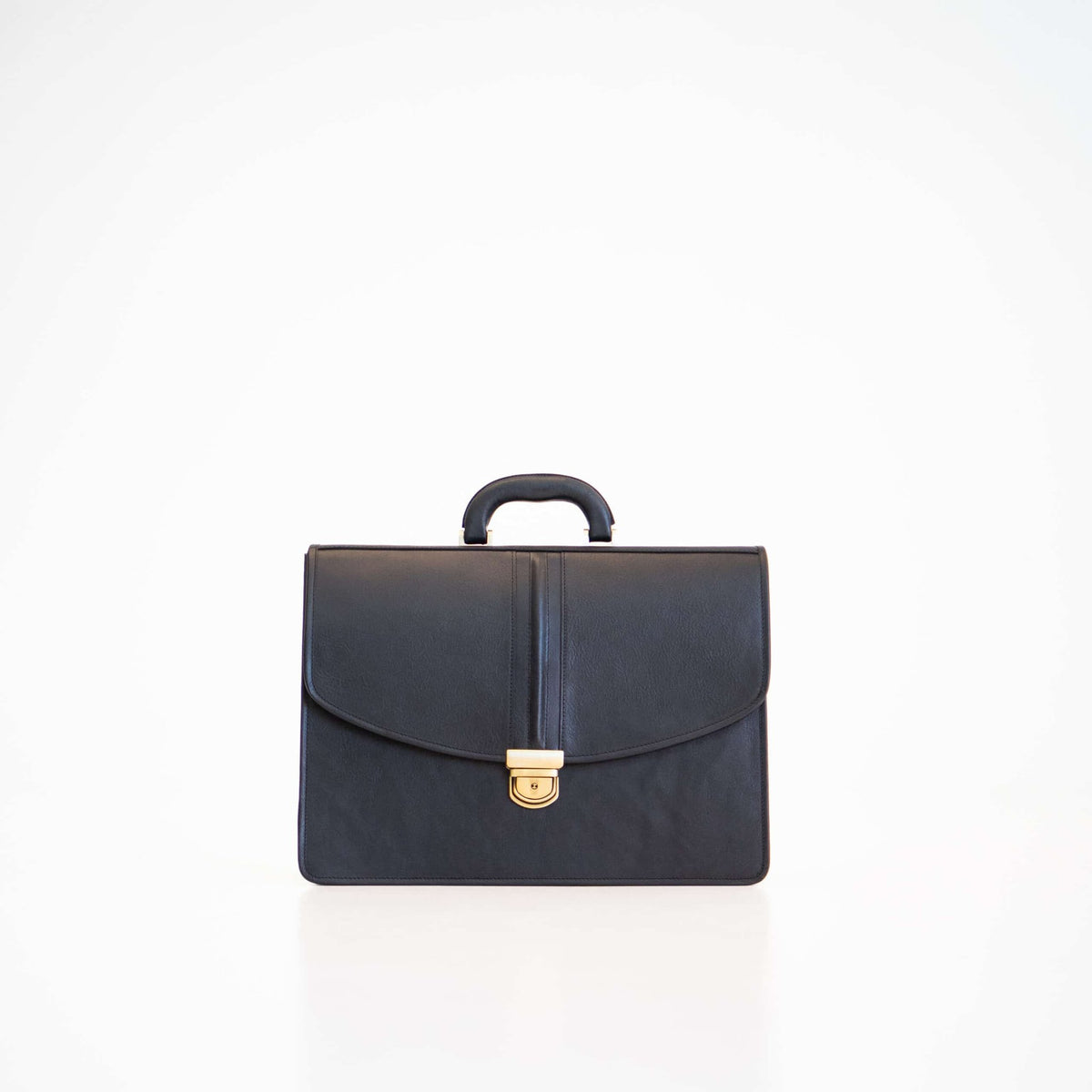 5. Studio shot of Papillon Leather Briefcase No. 99 in black, showing front view with handle