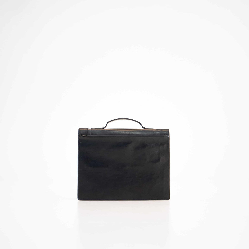 2. Back view of Papillon Briefcase No. 21 in black leather, studio setting