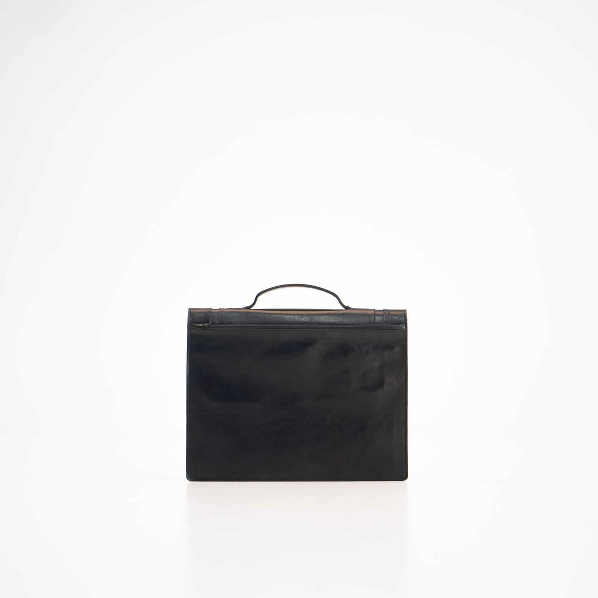 2. Back view of Papillon Briefcase No. 21 in black leather, studio setting