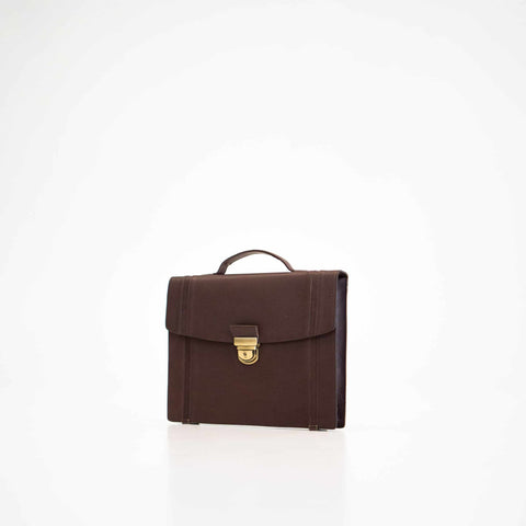 1. Papillon Briefcase No. 21 in dark brown leather, front view with gold clasp, studio setting