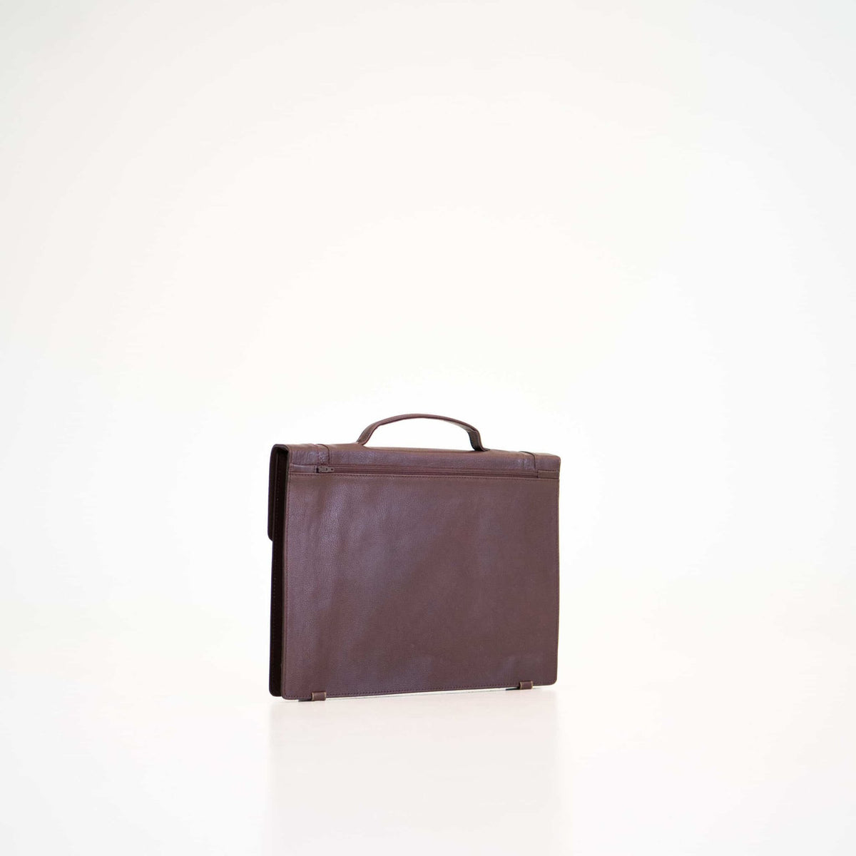 2. Papillon Briefcase No. 21 in dark brown leather, angled back view, studio setting