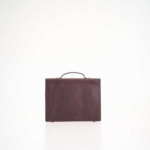 3. Papillon Briefcase No. 21 in dark brown leather, back view, studio setting