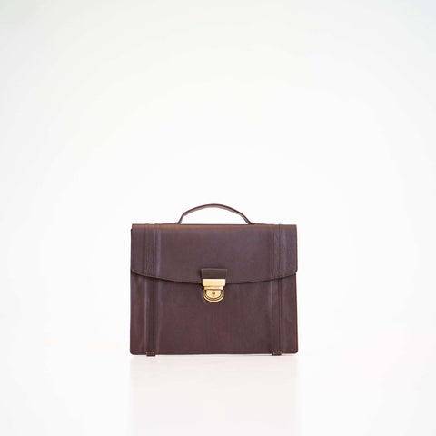 4. Papillon Briefcase No. 21 in dark brown leather, front view with handle, studio setting