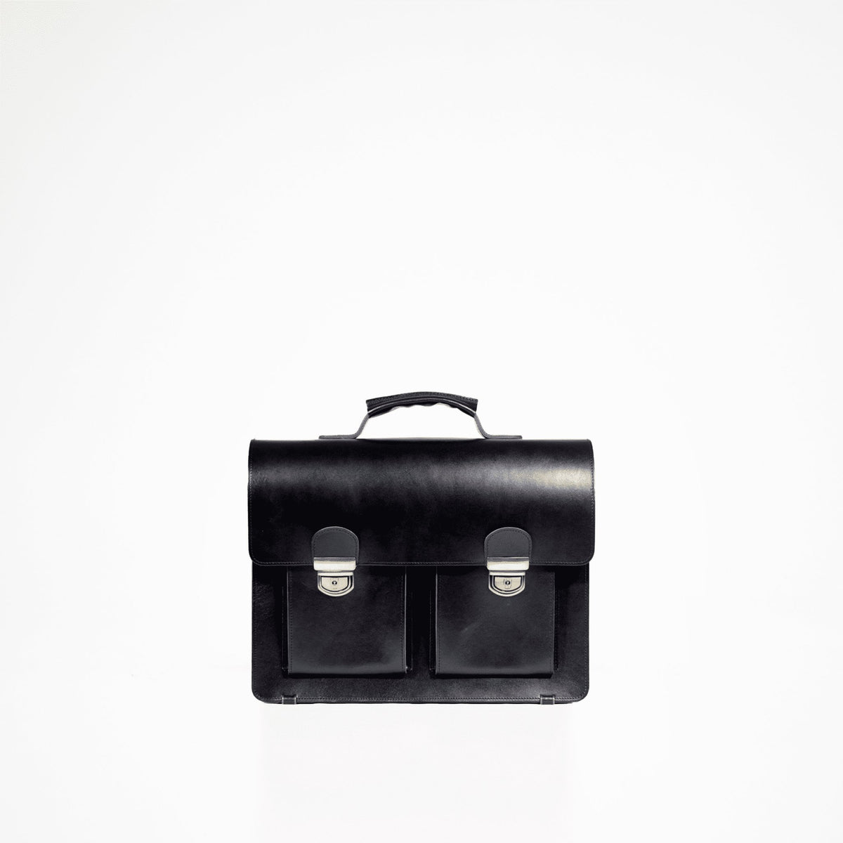 1. Studio shot of Papillon Briefcase No. 35 in black, showcasing genuine vegetable-tanned leather with dual front pockets and a top handle
