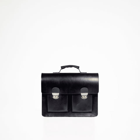 1. Studio shot of Papillon Briefcase No. 35 in black, showcasing genuine vegetable-tanned leather with dual front pockets and a top handle