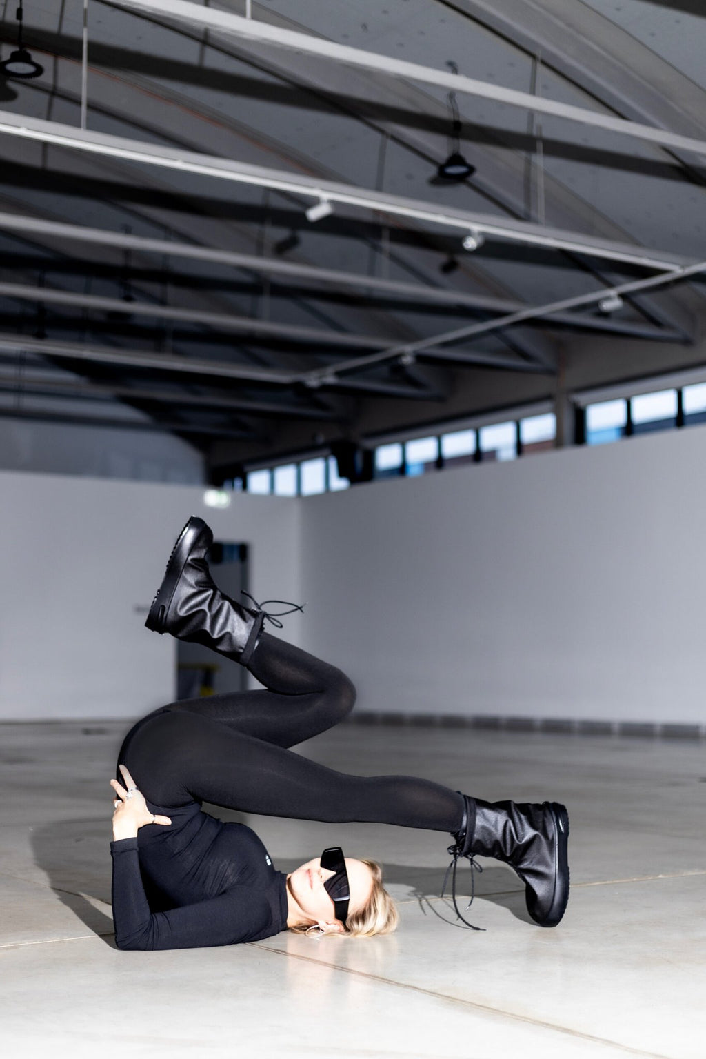 5. Woman in Samelin overboots, showcasing unique style and functionality in an indoor setting
