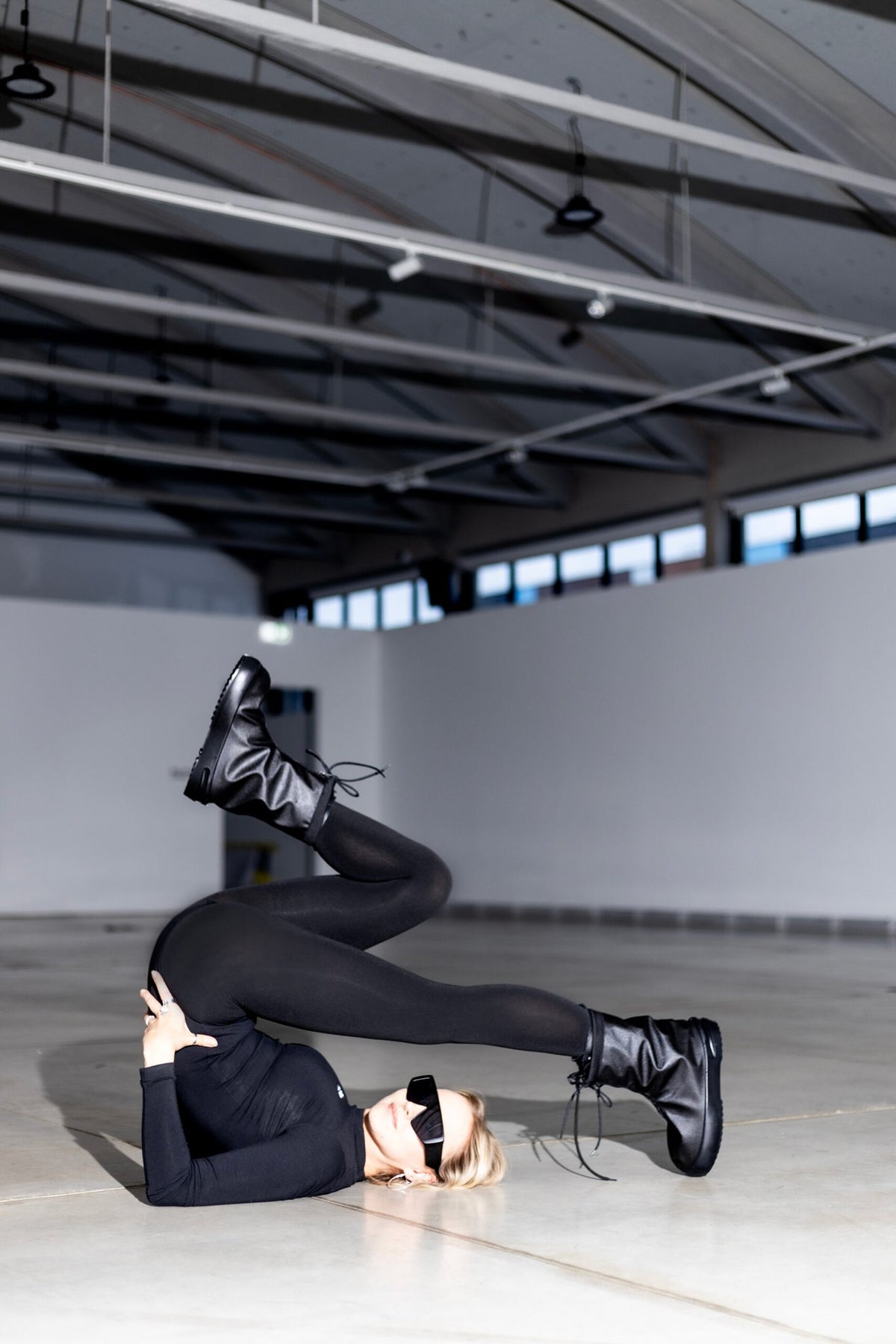 5. Woman in Samelin overboots, showcasing unique style and functionality in an indoor setting