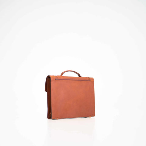 3. Side view of Papillon Briefcase No. 21 in cognac leather, highlighting slim design, studio setting