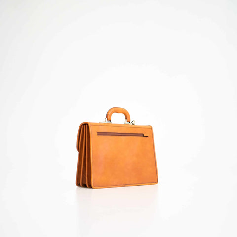 5. Angled back view of Papillon Briefcase No. 20 in cognac leather, highlighting craftsmanship