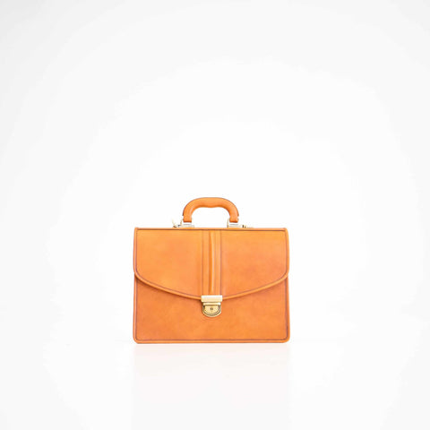 2. Front view of Papillon Briefcase No. 20 in cognac leather, highlighting elegant design