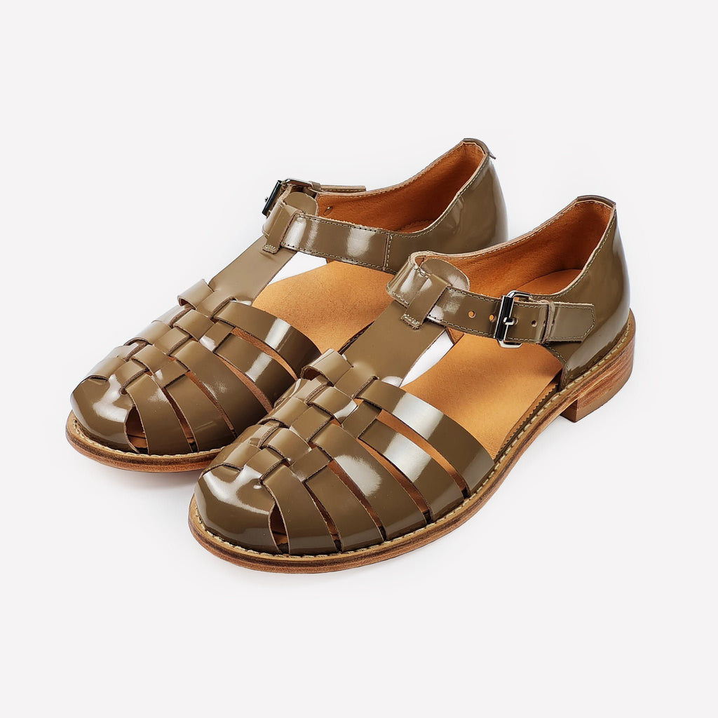 3. Studio shot of women's handmade beige leather fisherman sandals with strap-covered front and buckle