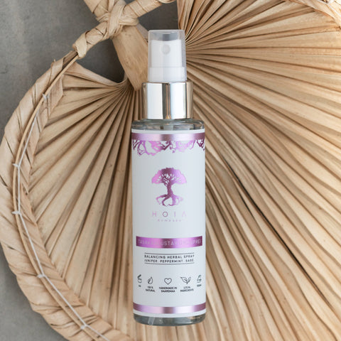 2. HOIA homespa Balancing Herbal Spray bottle with purple label, displayed on a woven background