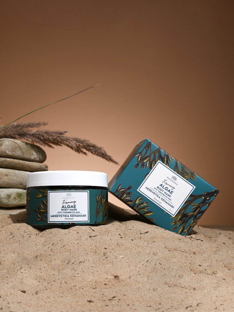 1. Magrada Firming Algae Body Mask and box on sand, showcasing therapeutic mud and peat mixture