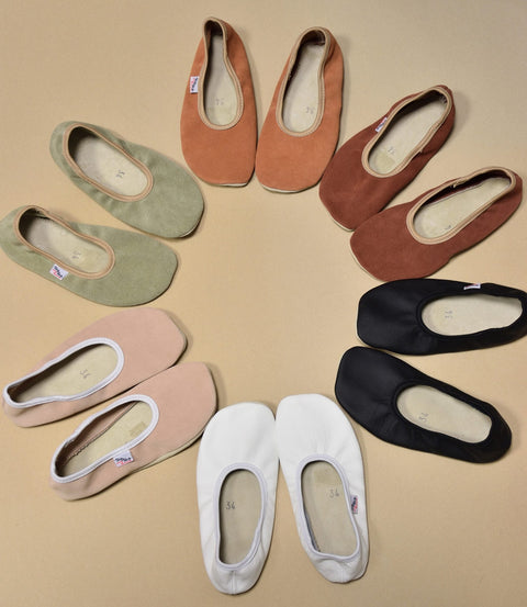 3. Flat lay of Hip-Hop barefoot slippers in various colors including nude, green, and black