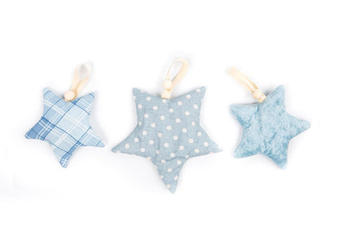 3. Set of three blue starlet toys with ribbons on white background