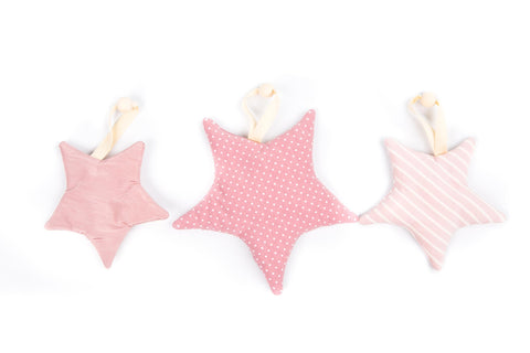 4. Set of three pink starlet toys with ribbons on white background